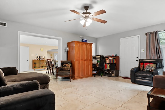 tiled living room featuring ceiling fan