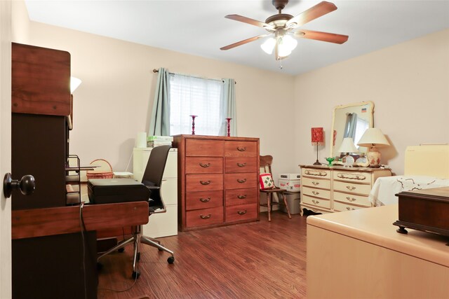 office space featuring dark wood-type flooring and ceiling fan