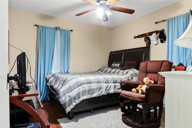 bedroom with ceiling fan and wood-type flooring