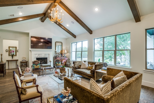 living room featuring lofted ceiling with beams, a fireplace, dark wood-type flooring, and a chandelier