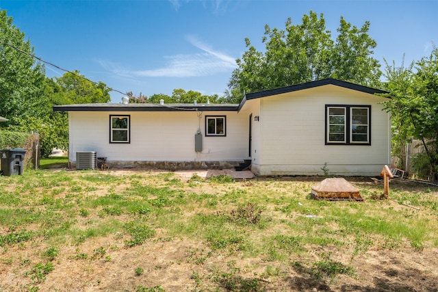 rear view of house with cooling unit