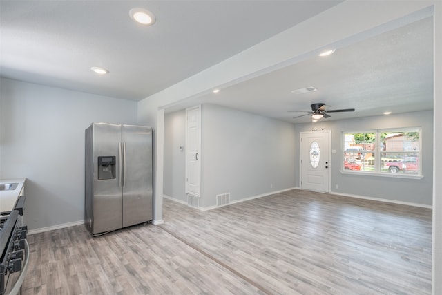 kitchen with ceiling fan, light hardwood / wood-style flooring, and appliances with stainless steel finishes