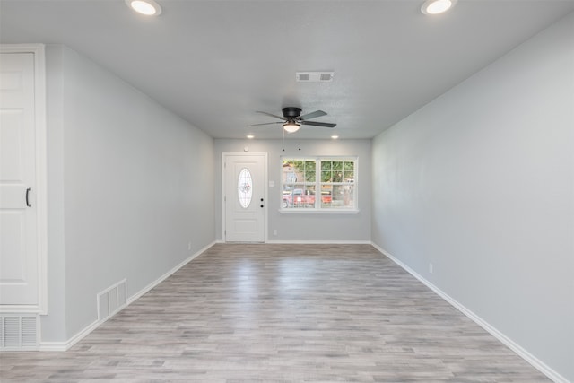 foyer entrance with light wood-type flooring and ceiling fan