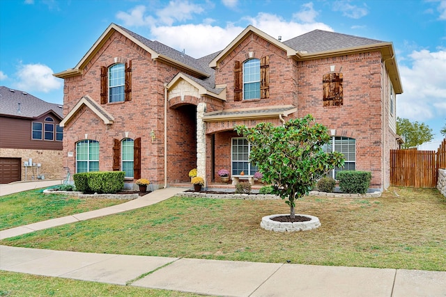 view of front property with a front yard and a garage