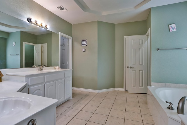 bathroom featuring vanity, tile patterned floors, and a relaxing tiled tub