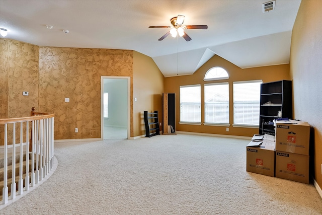 bonus room with lofted ceiling, light carpet, and ceiling fan