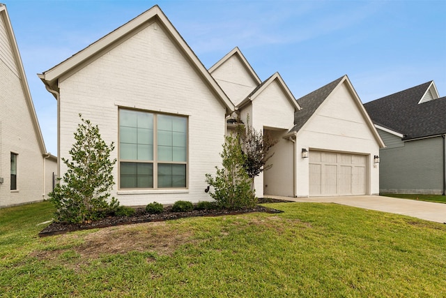 view of front of property with a garage and a front yard