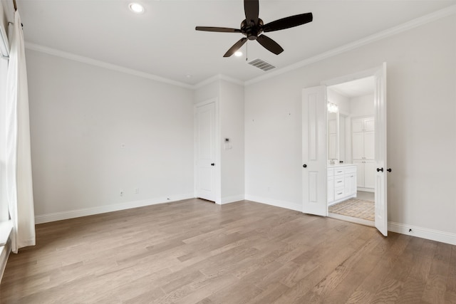 unfurnished bedroom featuring ceiling fan, connected bathroom, light hardwood / wood-style flooring, and ornamental molding