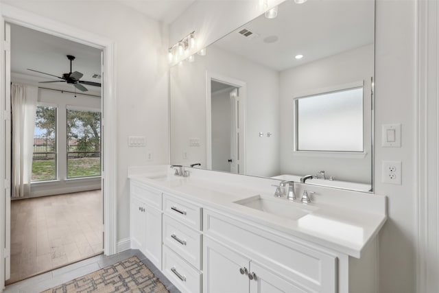 bathroom featuring vanity, hardwood / wood-style flooring, and ceiling fan