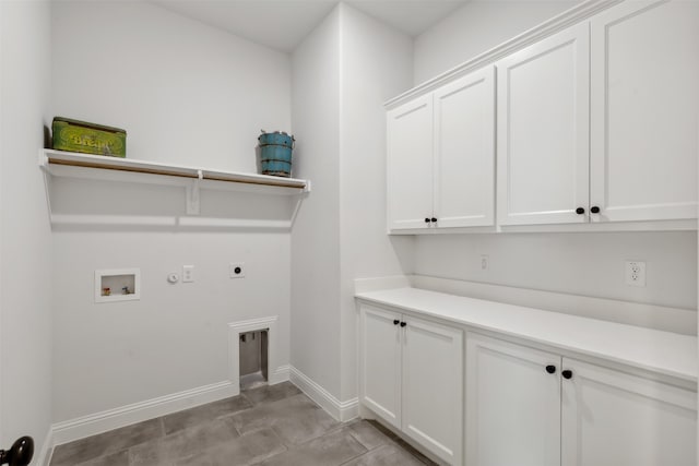 laundry area featuring light tile patterned flooring, hookup for a washing machine, hookup for a gas dryer, cabinets, and electric dryer hookup