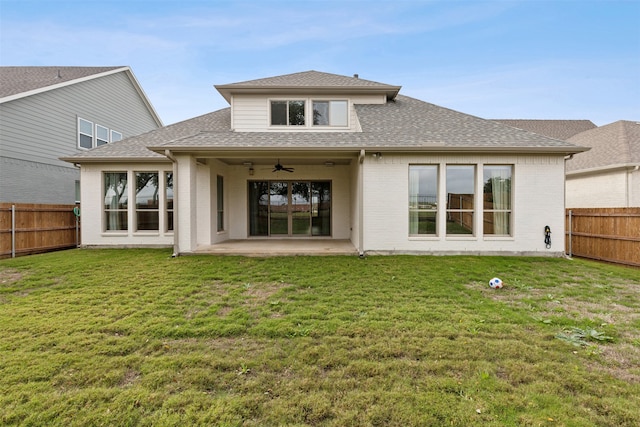 back of property featuring ceiling fan, a yard, and a patio area