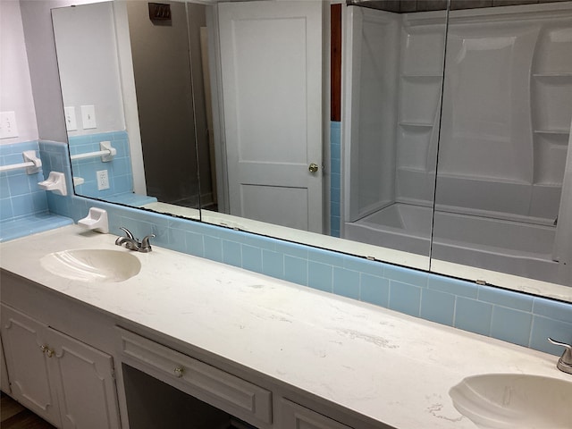 bathroom featuring bathtub / shower combination and vanity