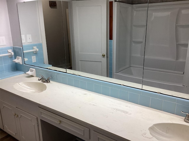 604 S Seaman St, Eastland, TX 76448 - bathroom with vanity,  shower combination, and backsplash