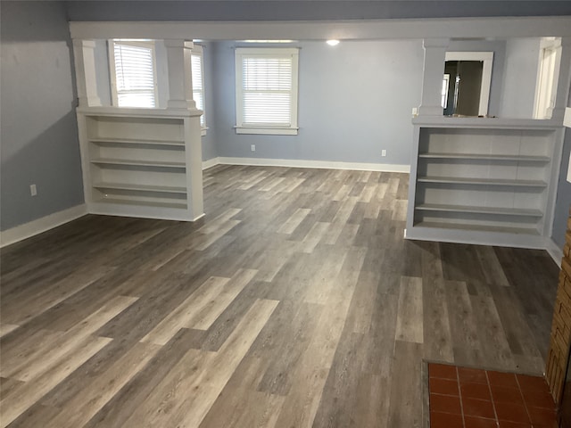 basement featuring hardwood / wood-style flooring and a healthy amount of sunlight