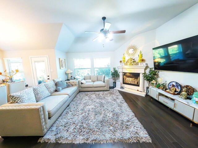 living room featuring ceiling fan, dark hardwood / wood-style floors, and lofted ceiling