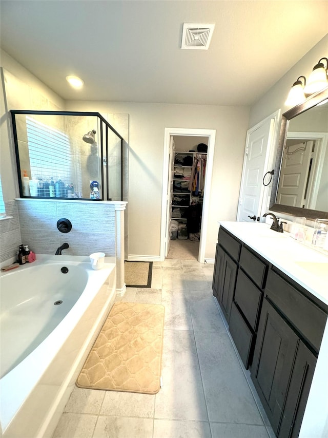 bathroom with vanity, ceiling fan, and tile patterned floors