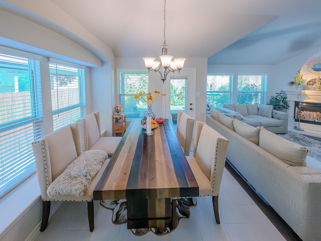 dining space featuring plenty of natural light and a chandelier