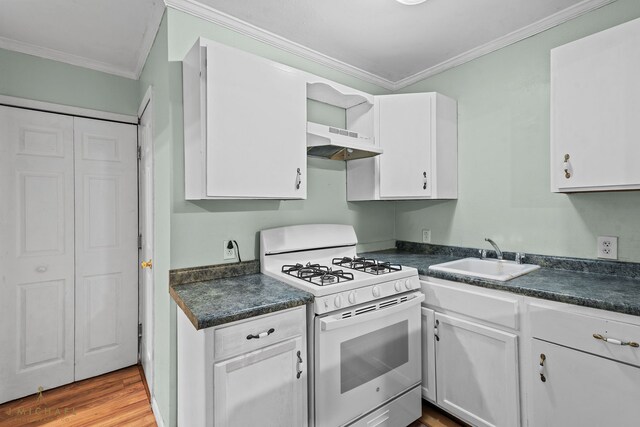 kitchen with sink, ornamental molding, ventilation hood, white cabinetry, and white range with gas stovetop