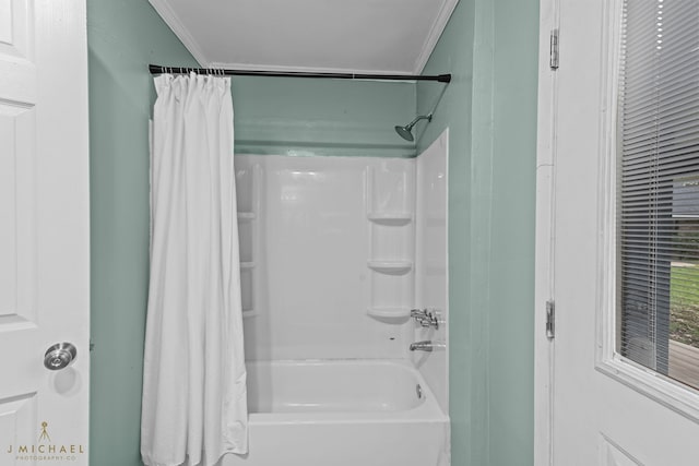 bathroom featuring shower / bath combo and crown molding