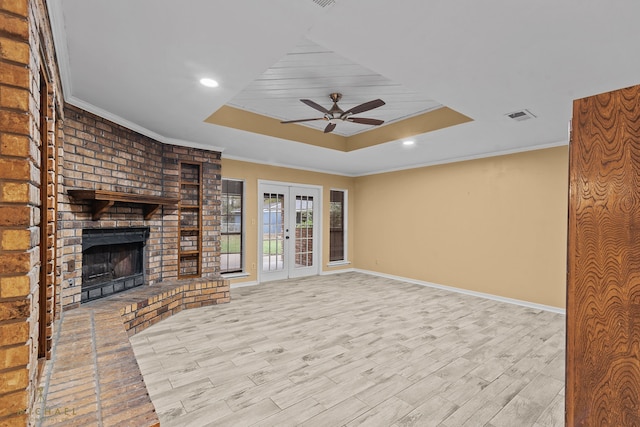 unfurnished living room with light wood-type flooring and ornamental molding