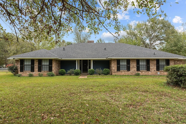 single story home with a front yard