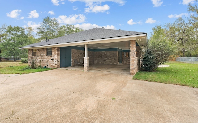 view of home's exterior featuring a lawn and a carport