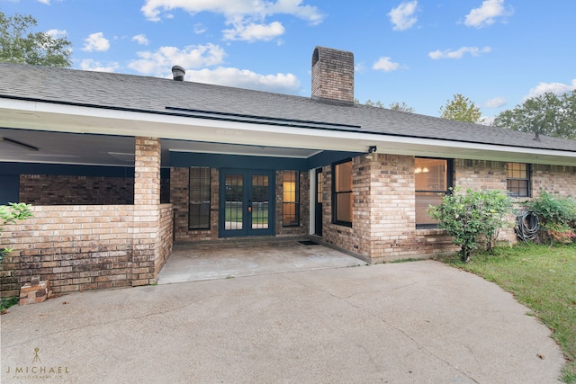 back of property featuring french doors