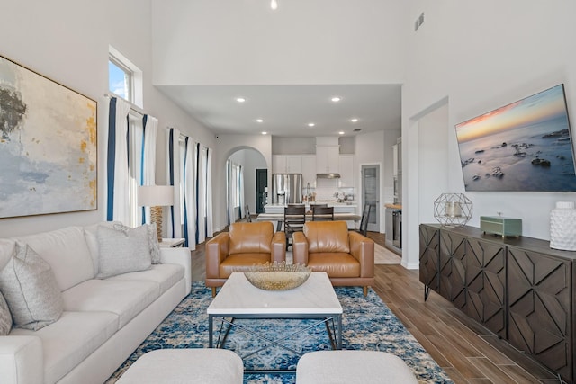 living room featuring a high ceiling