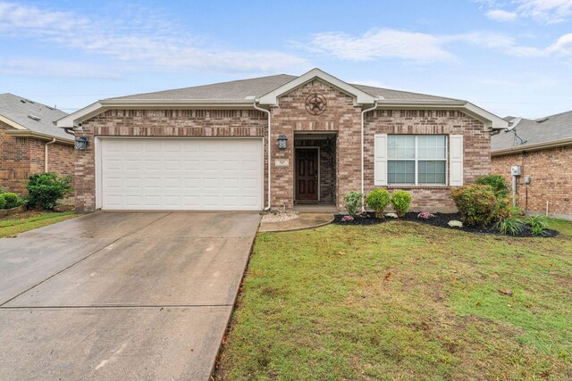 ranch-style home with a garage and a front lawn