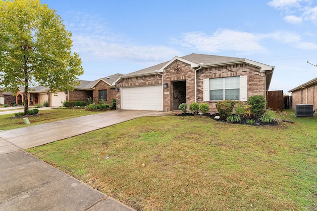 ranch-style home featuring a garage, a front lawn, and central air condition unit