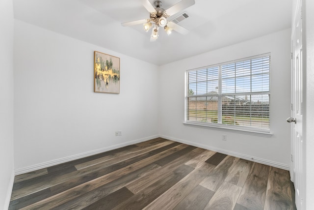 empty room featuring dark hardwood / wood-style floors and ceiling fan