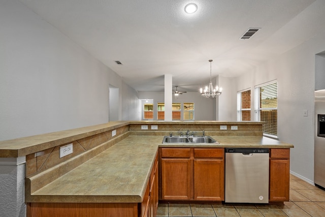 kitchen featuring sink, appliances with stainless steel finishes, ceiling fan with notable chandelier, light tile patterned floors, and hanging light fixtures