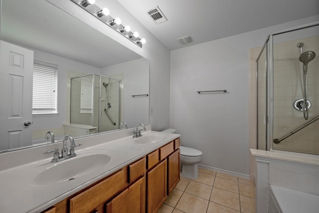 full bathroom featuring shower with separate bathtub, toilet, tile patterned flooring, a textured ceiling, and vanity