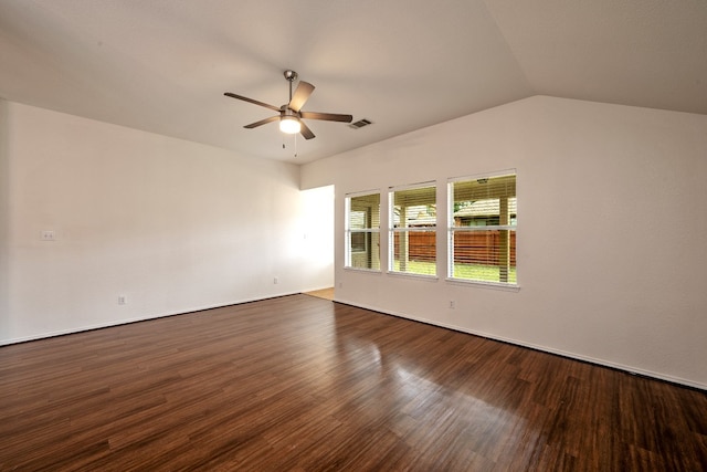 spare room with dark hardwood / wood-style flooring, ceiling fan, and vaulted ceiling