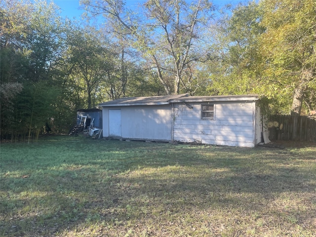 view of outdoor structure with a yard