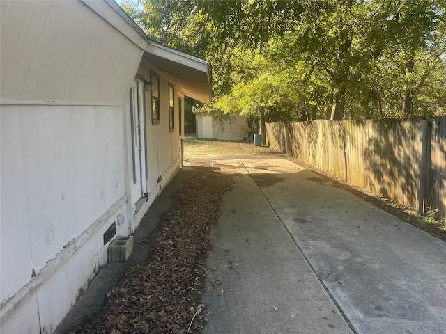 view of side of home featuring a patio