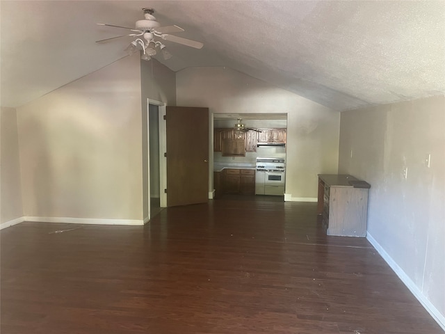 unfurnished living room with ceiling fan, lofted ceiling, a textured ceiling, and dark hardwood / wood-style floors