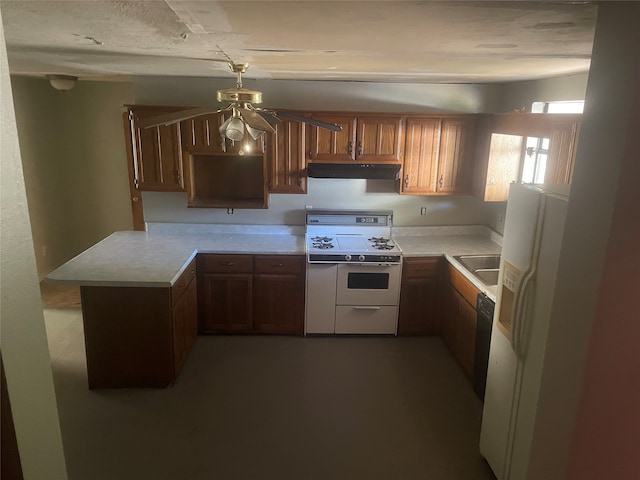 kitchen featuring dishwasher, range, sink, white fridge with ice dispenser, and ceiling fan