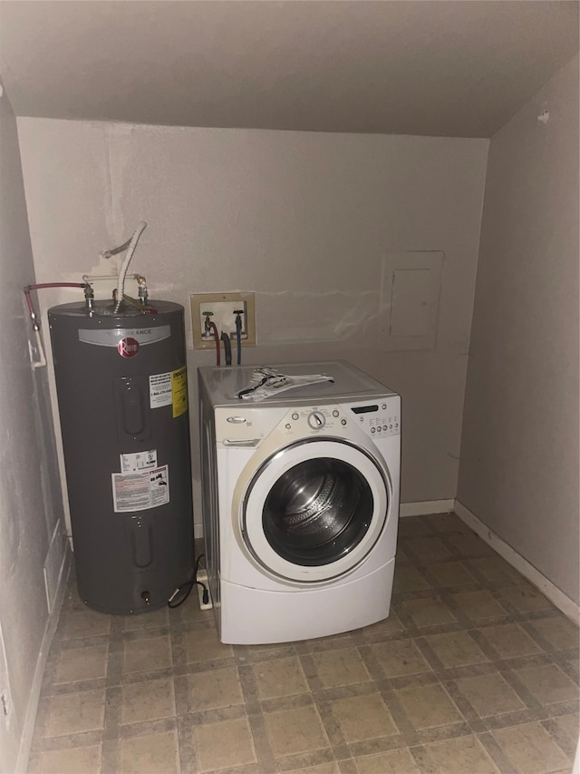 washroom with electric water heater and washer / dryer