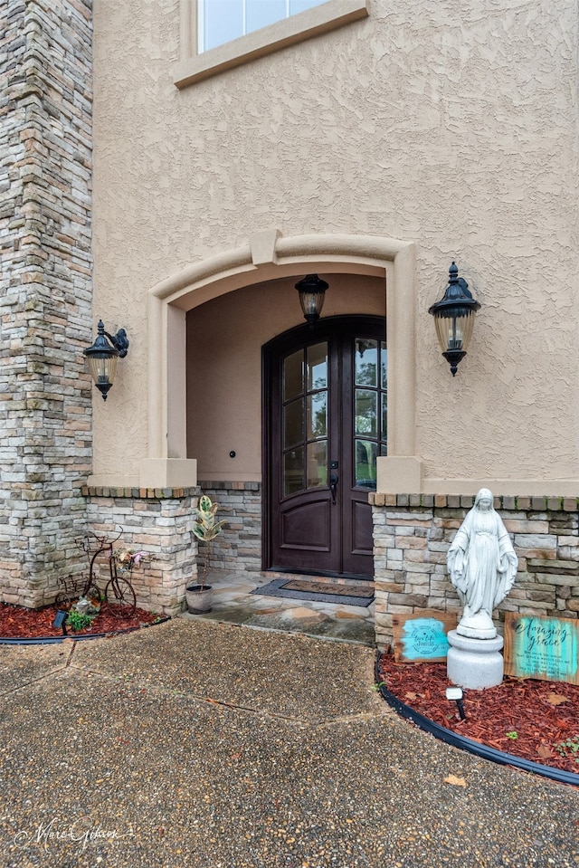 entrance to property featuring french doors