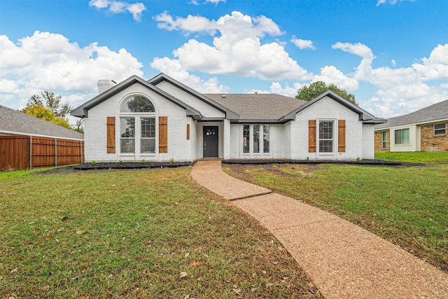 ranch-style home with a front lawn