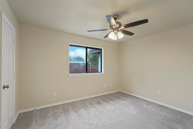 unfurnished room with ceiling fan and carpet flooring