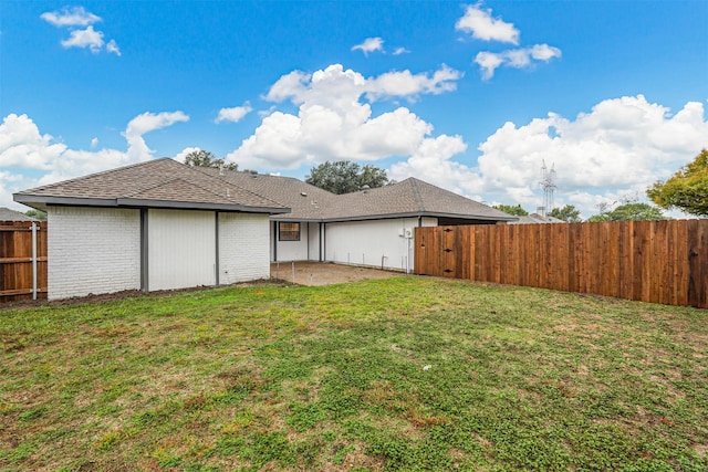 exterior space with a patio area and a yard