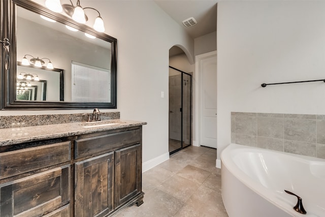 bathroom featuring plus walk in shower and vanity