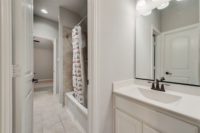 bathroom with shower / tub combo with curtain, vanity, and tile patterned flooring