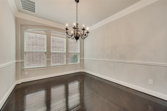 unfurnished room with ornamental molding, dark hardwood / wood-style floors, and a chandelier