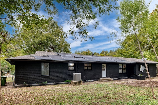 back of property featuring cooling unit