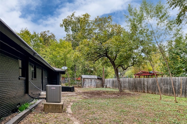 view of yard with a storage unit and central AC