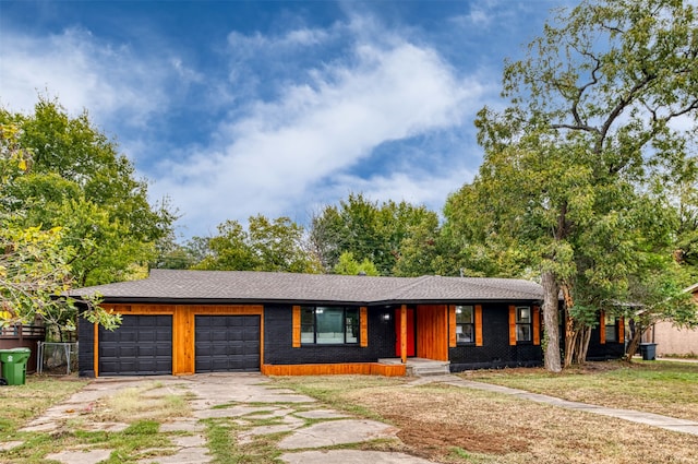 ranch-style home with a garage