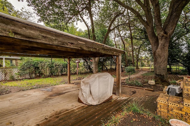 wooden deck featuring grilling area